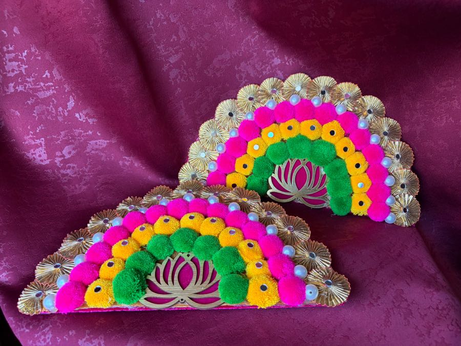 Colourful decorative pom-pom fan home decor piece